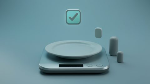 Conceptual illustration of a plate on a digital scale with a checkmark and small nutrient bars, evoking accurate food and macro tracking