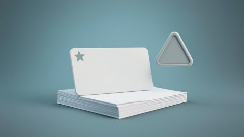 Conceptual illustration of an ID card with a star, a stack of documents, and a small warning triangle, evoking Real ID paperwork problems at the DMV